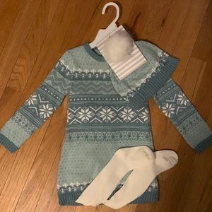 Sweater dress with tights and hat